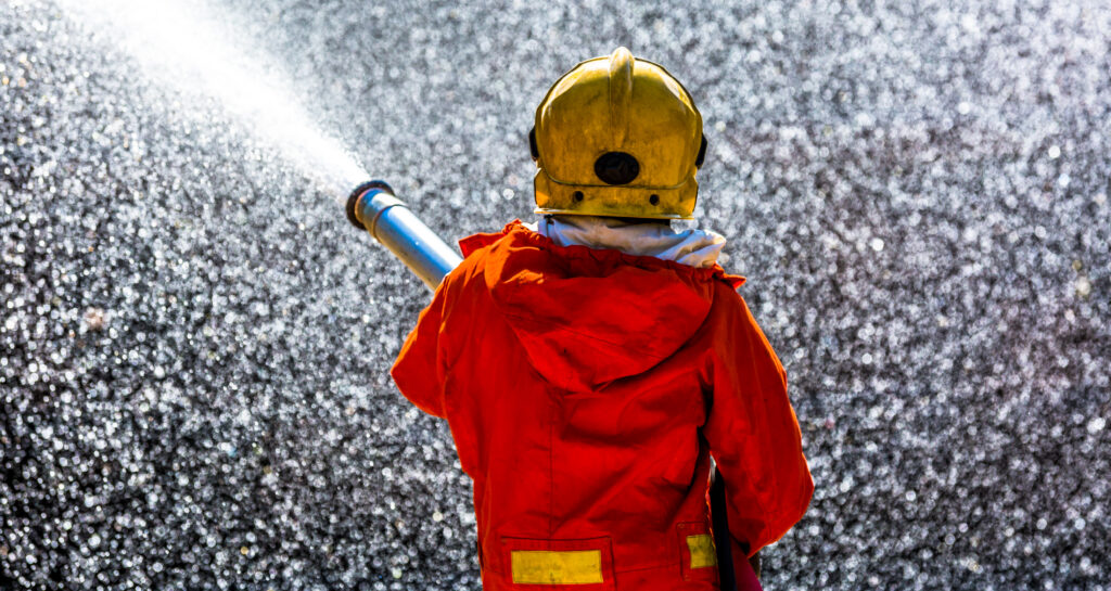 Firefighter Spraying Water