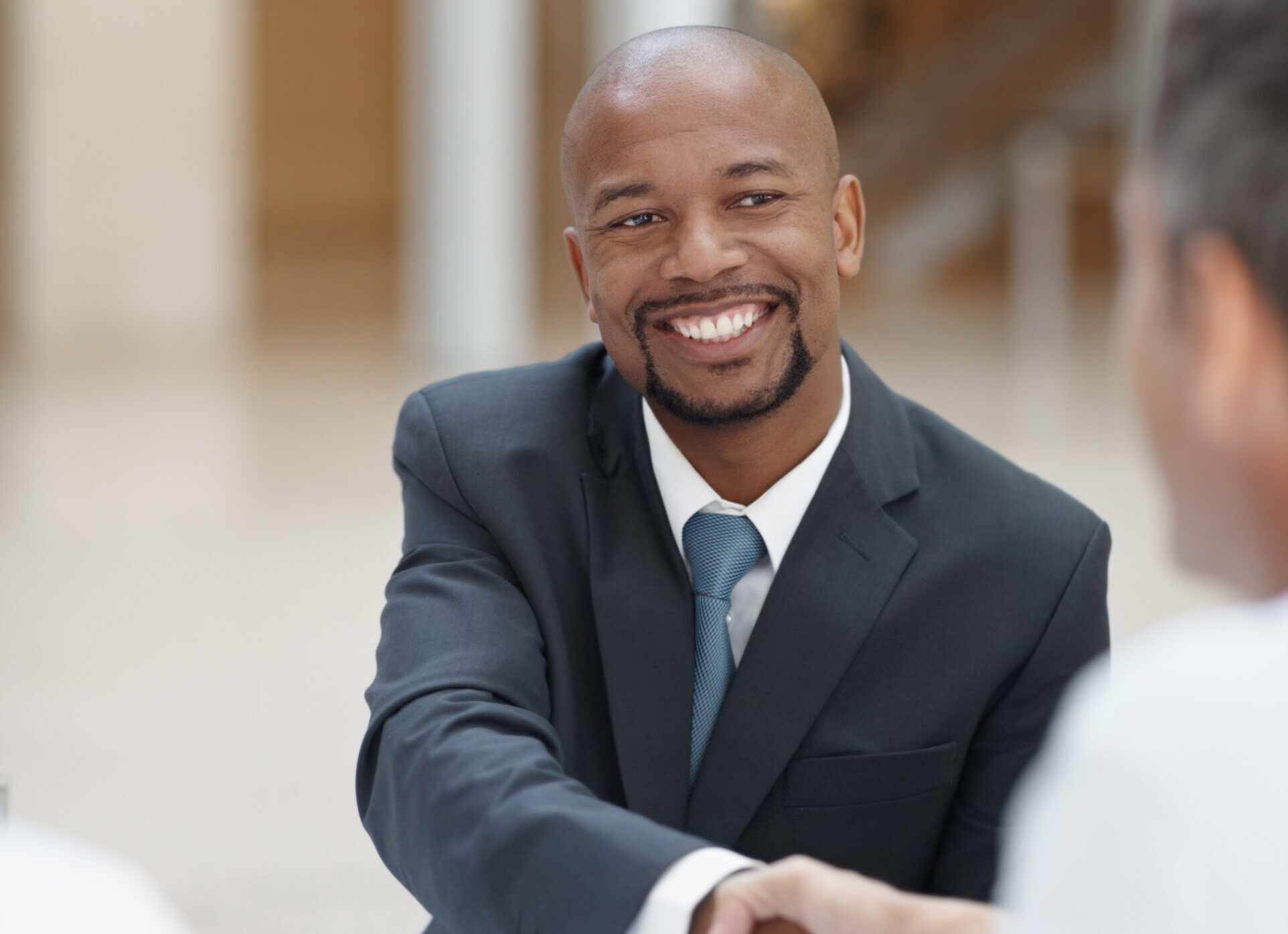 smiling businessman meeting with handshake deal teamwork