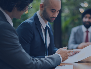 Business men in suits discussing business at table