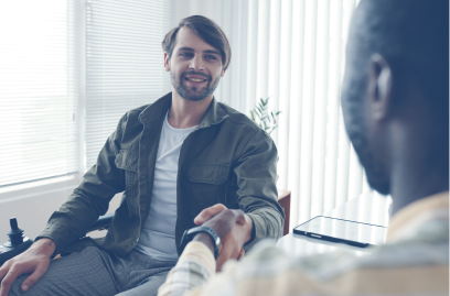 Businessman with disability greeting his colleague