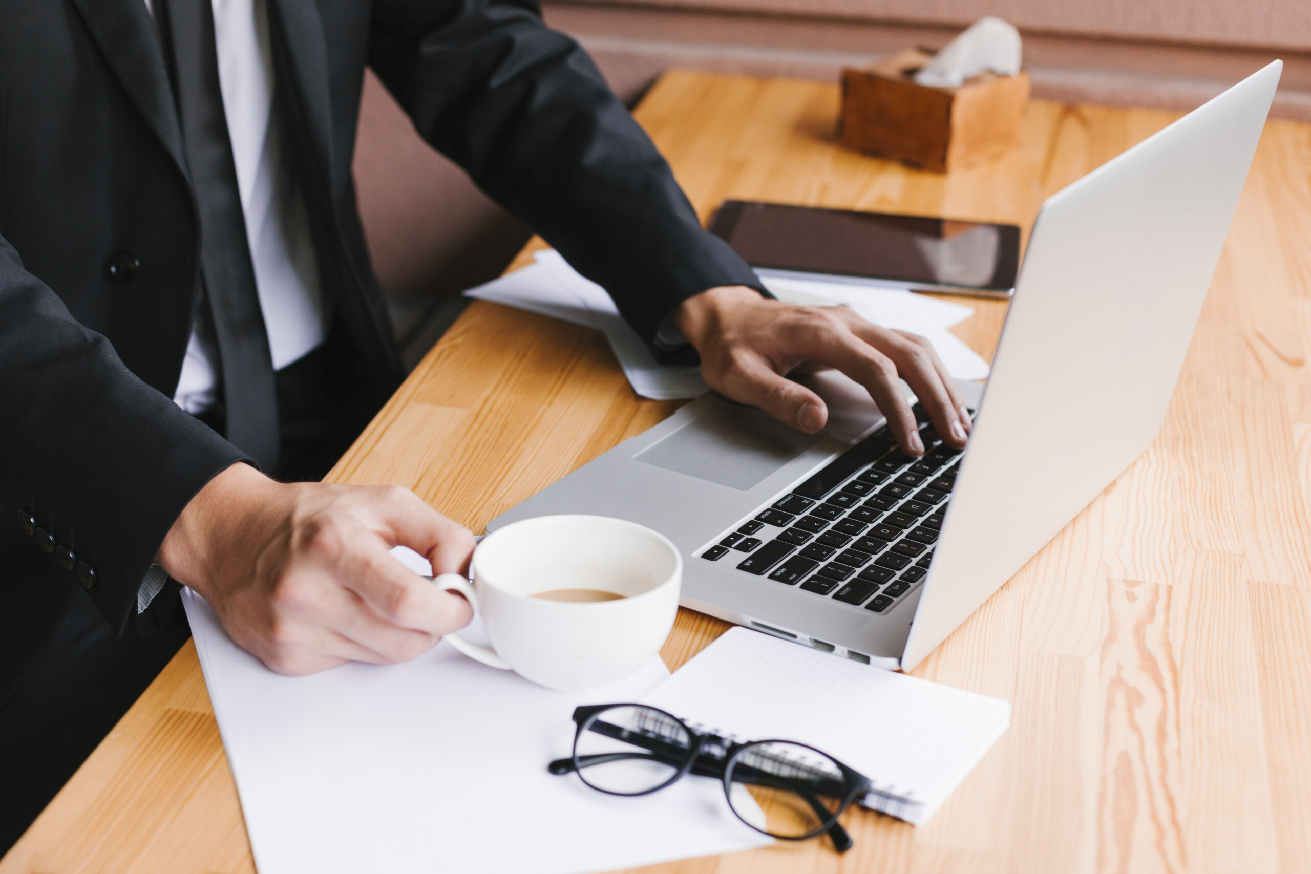 Office desk with laptop coffee